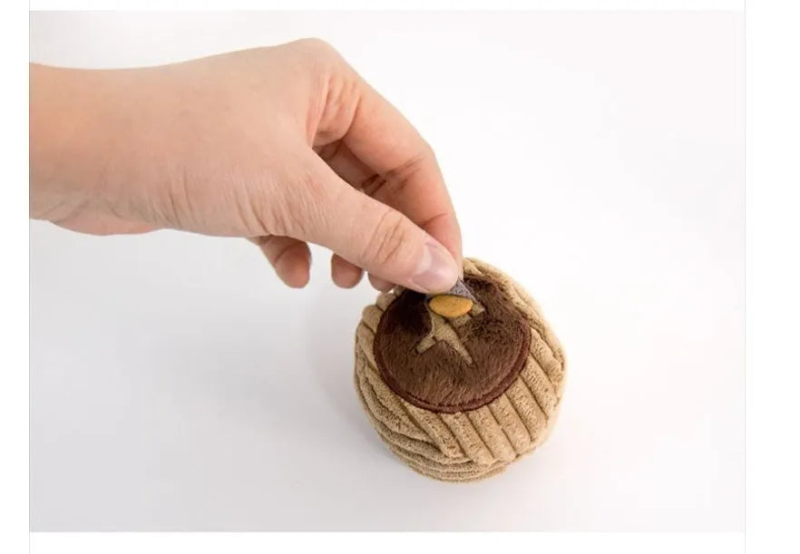 Hidden food toy set for dogs with two walnut toys, one peanut toy, and a rustling paper snack bag on a table