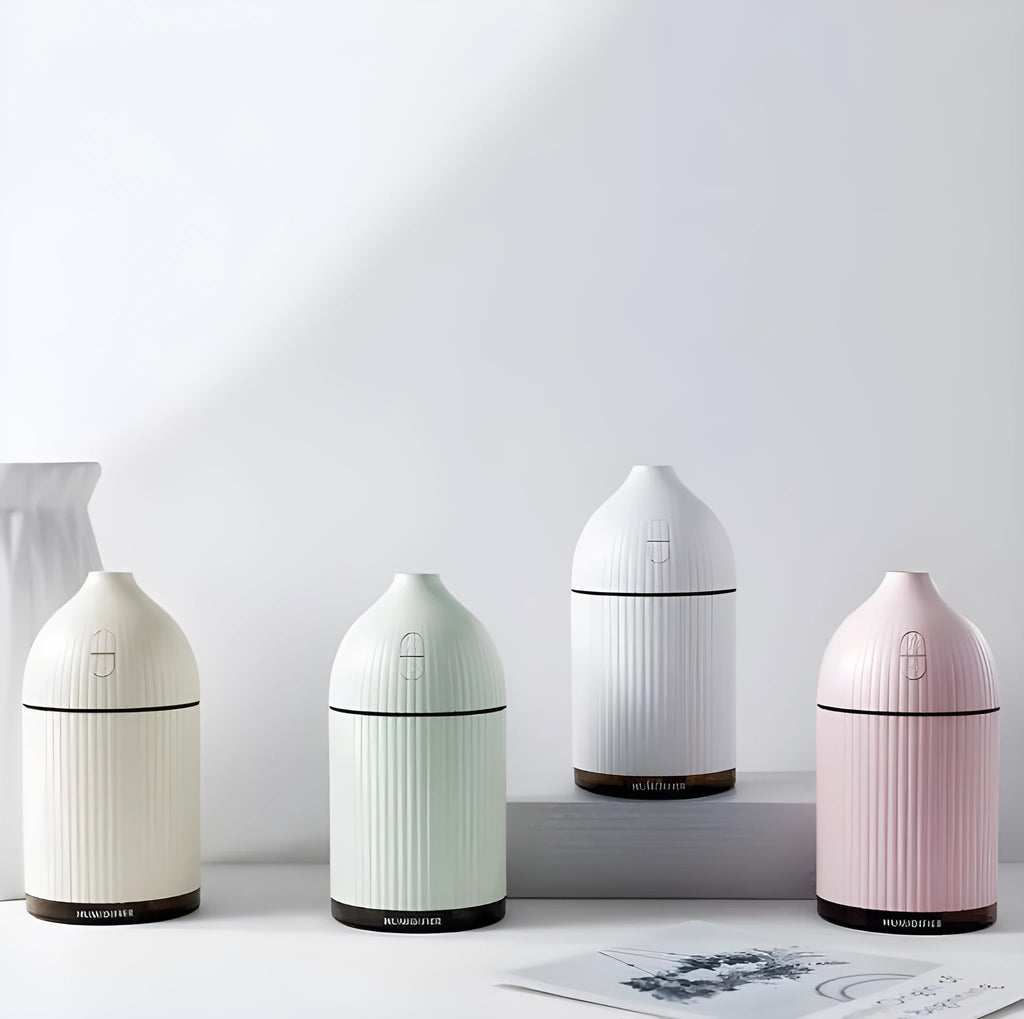 White ultrasonic essential oil diffuser and humidifier with LED light, 300ml capacity, USB cable.
