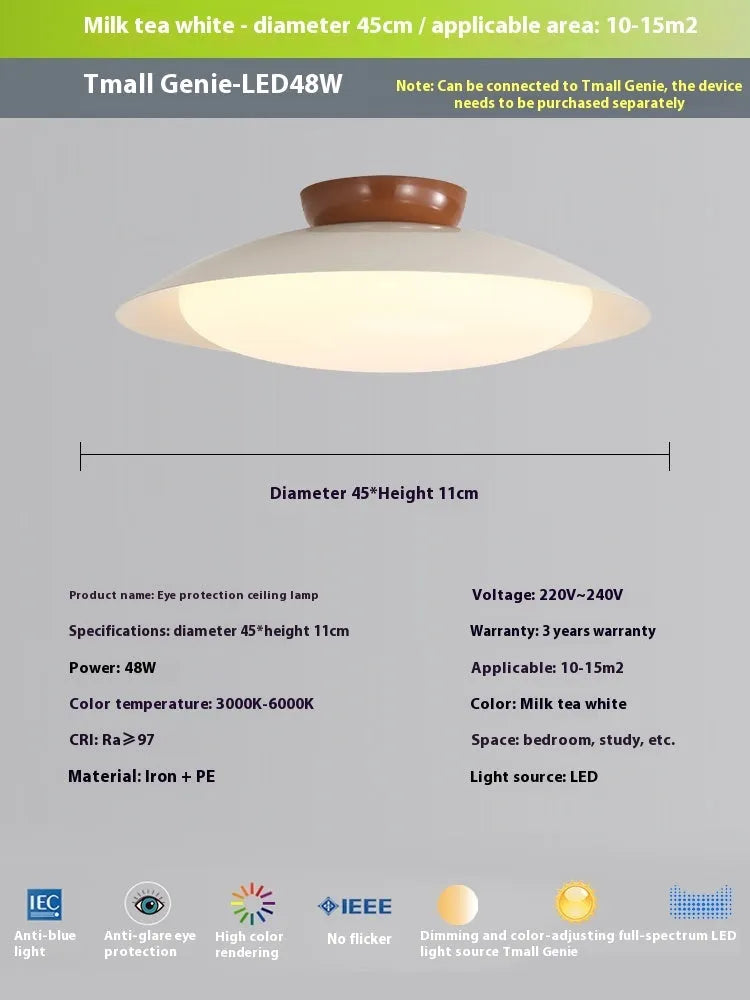 Modern minimalist cream style flying saucer ceiling lamp in mint green on a white ceiling.