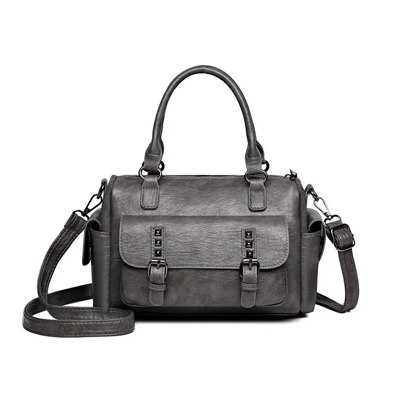 Vintage-style large square messenger bag in PU leather with contrast stitching.