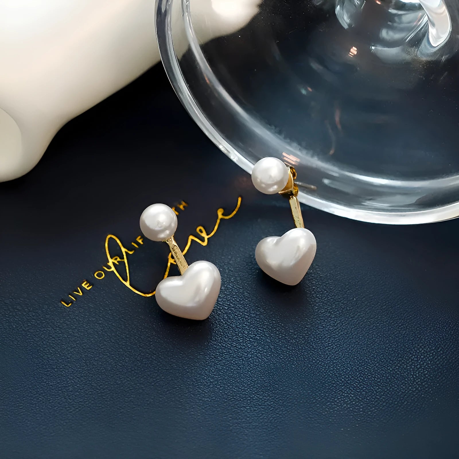 Heart-shaped pearl stud earrings with alloy settings and electroplated metallic finish