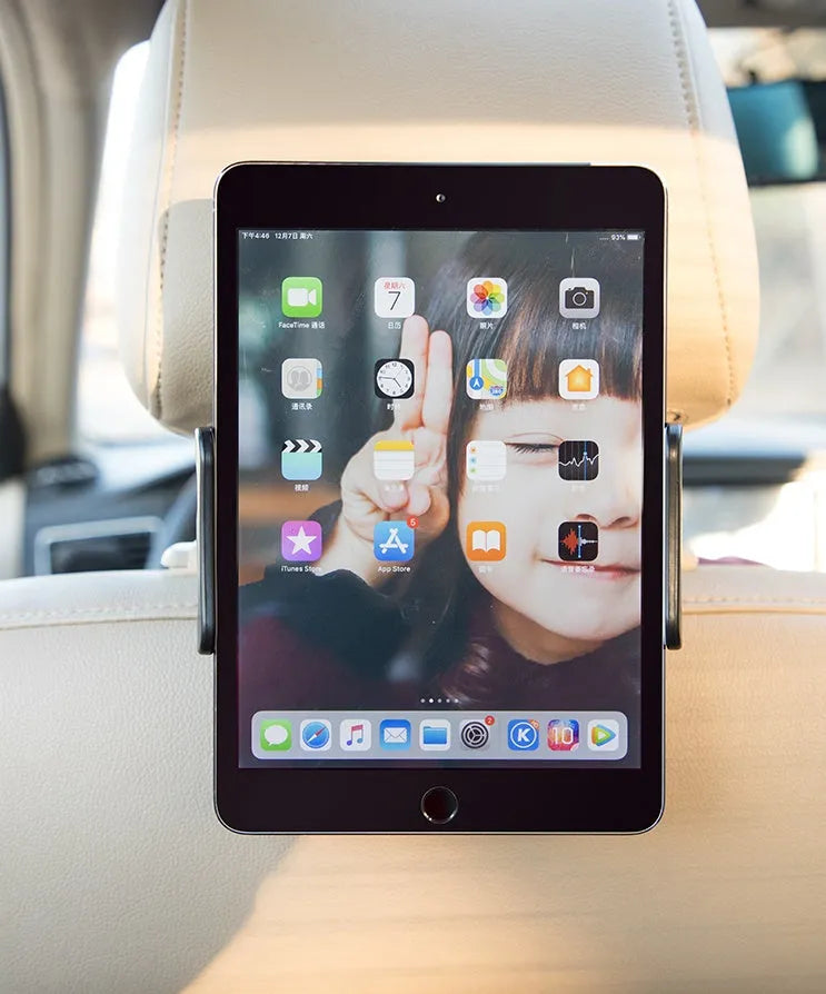 Black universal car phone and iPad holder mounted on a car seat headrest.