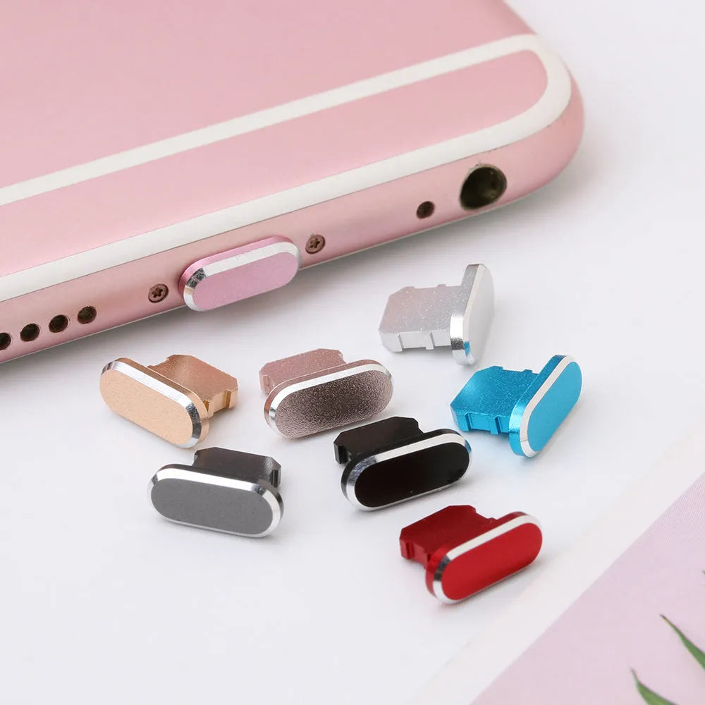 Aluminium alloy dust plug for iPhone charging port in various colours including gold, silver, blue, and rose gold.