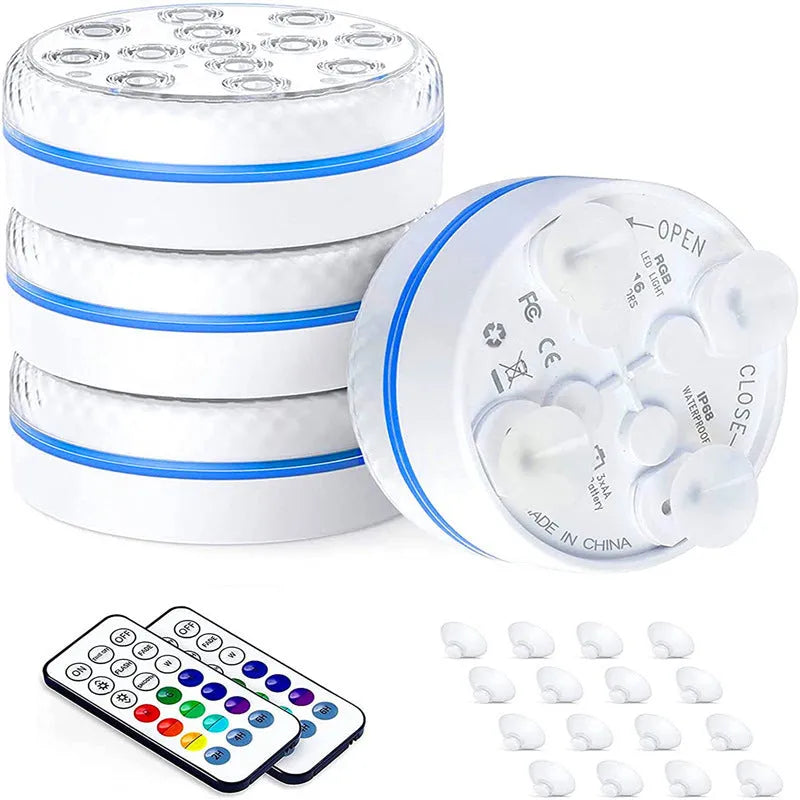 Remote control and a small cylindrical IP68 waterproof diving light with colour changing LEDs for aquariums.