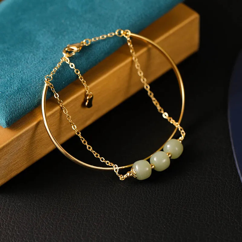 Women's Hetian jade lucky beads bracelet with gold inlay, showing single, double, and three bead style options.