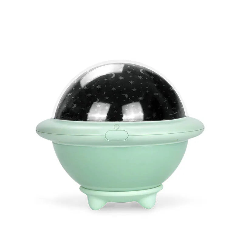 Green UFO shaped LED night light projecting starry sky pattern on ceiling