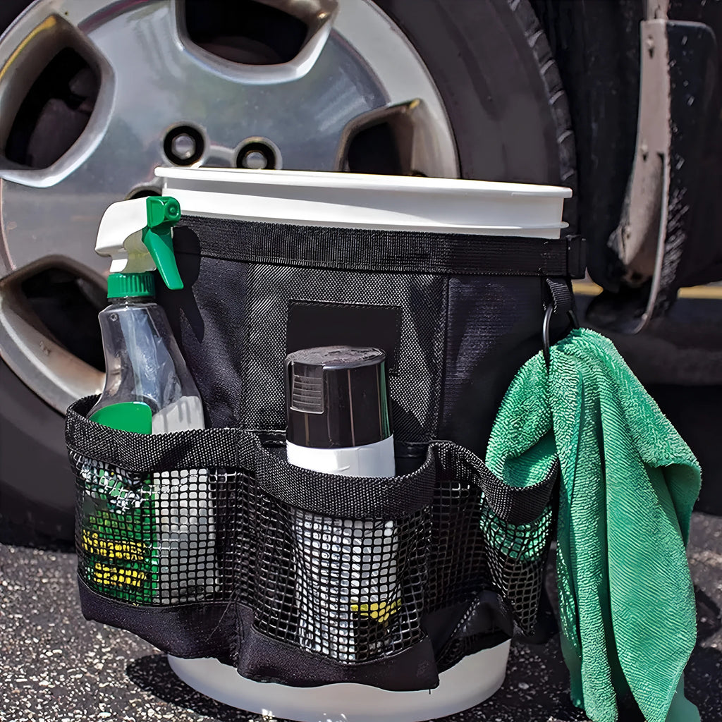 Black cylindrical polyester storage bag hanging on the side of a 5 gallon bucket.