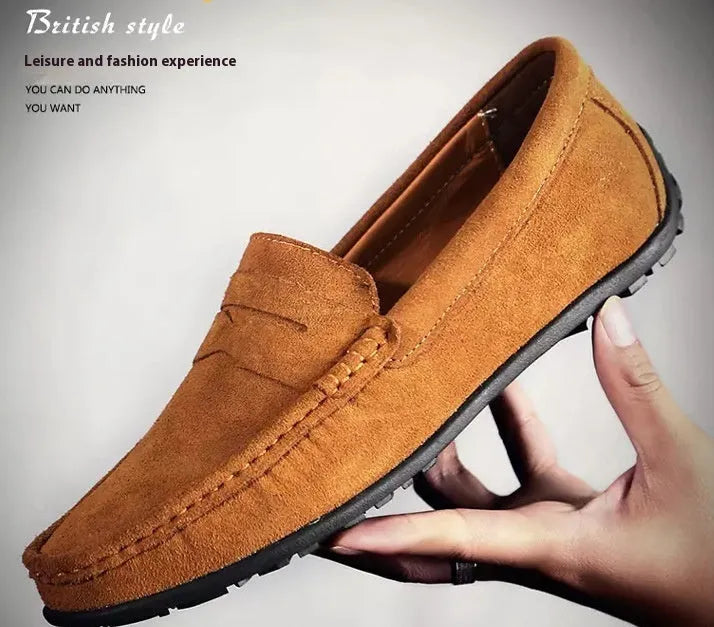 Men's brown suede casual loafers with flat rubber sole and round toe on a white background
