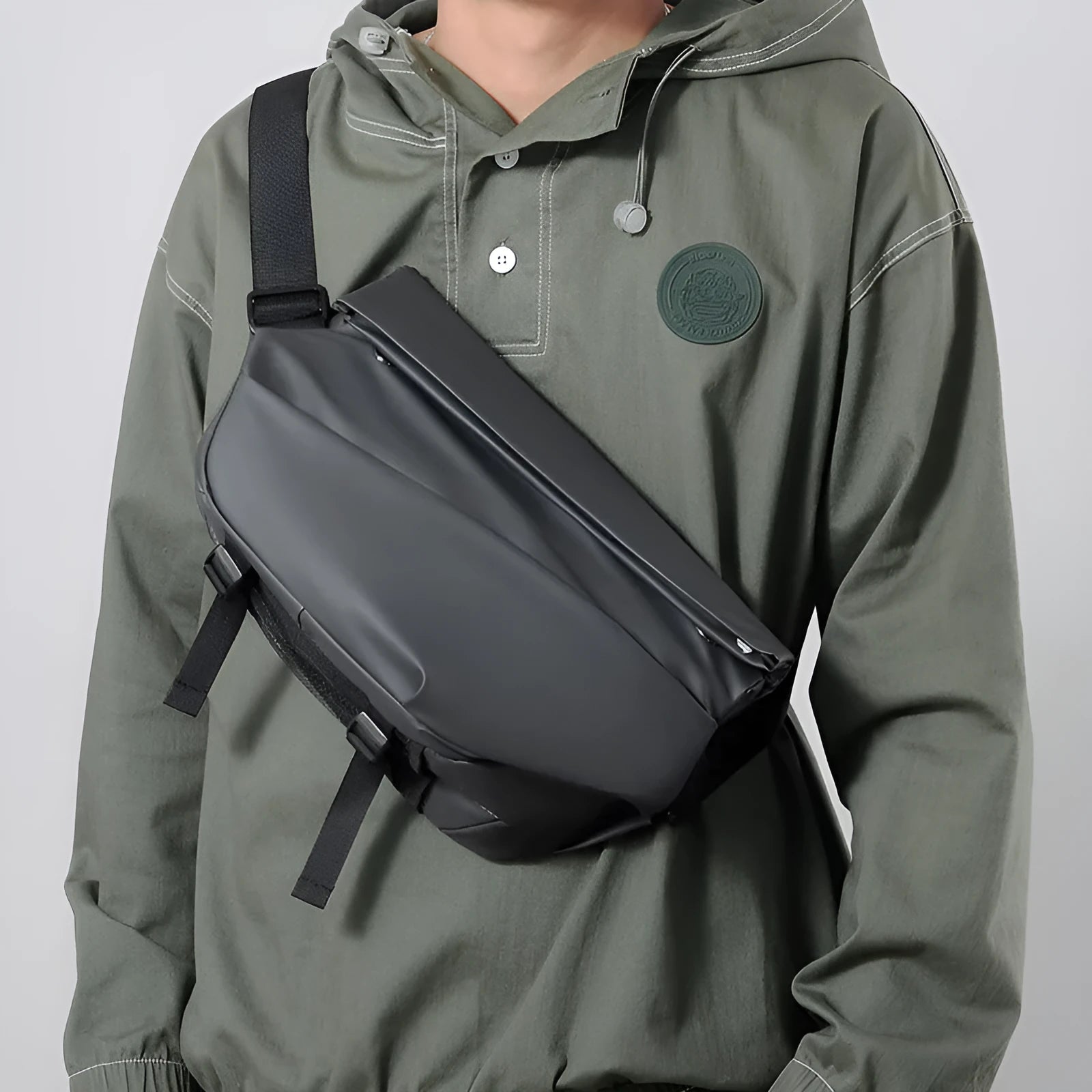 Grey PU leather men's crossbody bag with a shoulder strap, shown with open compartment for phone and documents.