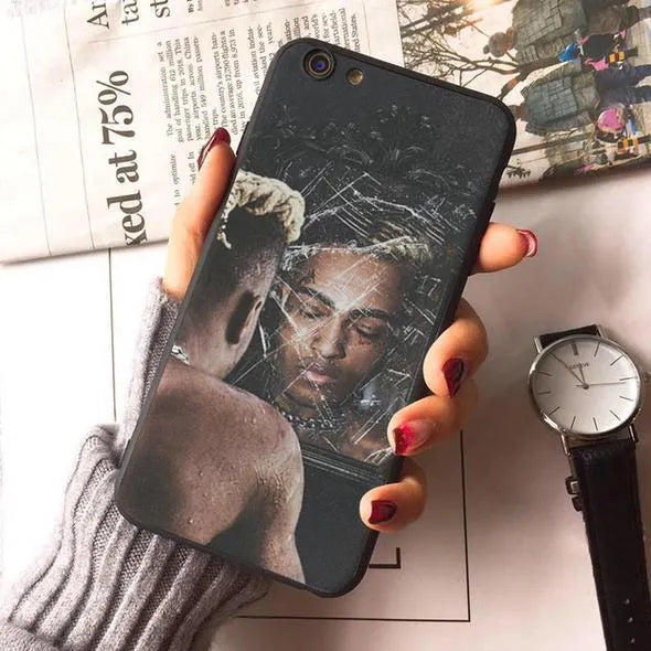 Transparent matte iPhone case with XXXTentacion artwork, shown on an iPhone model