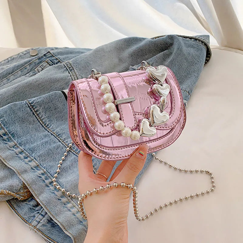 Silver laser pearl women's mini crossbody bag with a horizontal square shape and single shoulder strap.