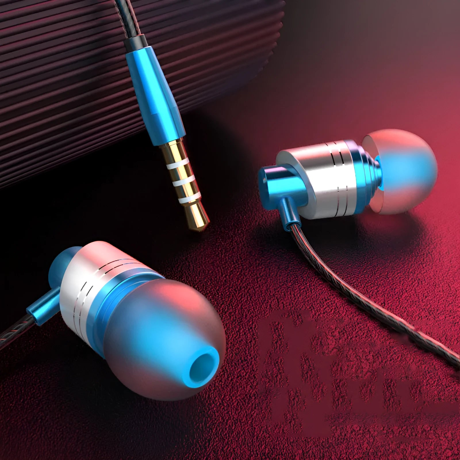 Wired in-ear headphones with 3.5mm plug, microphone, and silicone ear tips in black, blue, and red colours