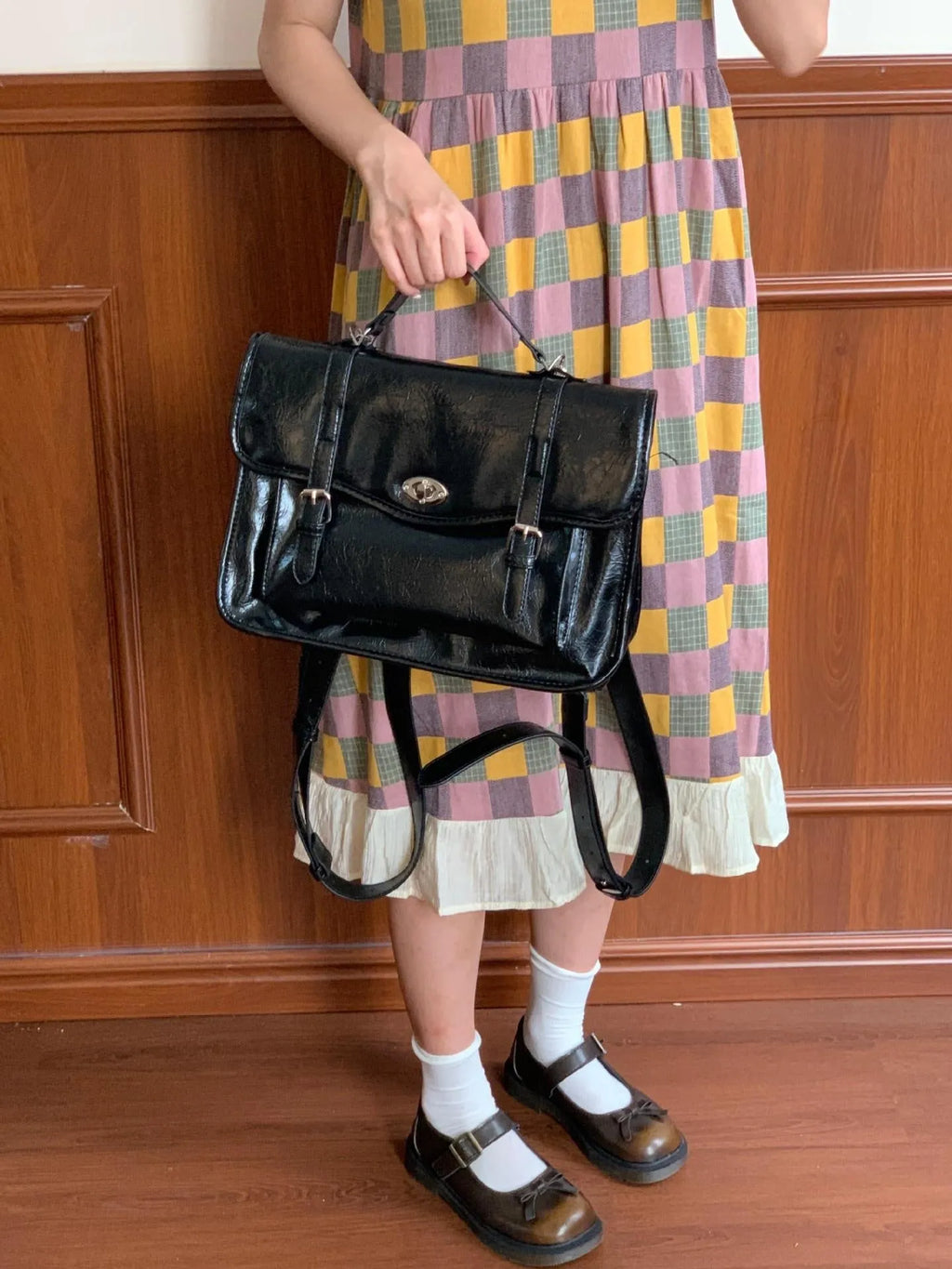 Black college messenger bag with PU construction showing 35cm length dimensions