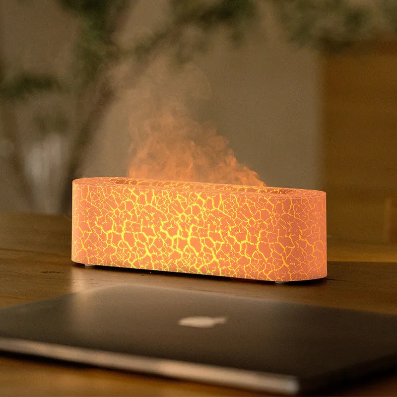 Square black creative lava flame USB desktop humidifier and essential oil diffuser on a desk.