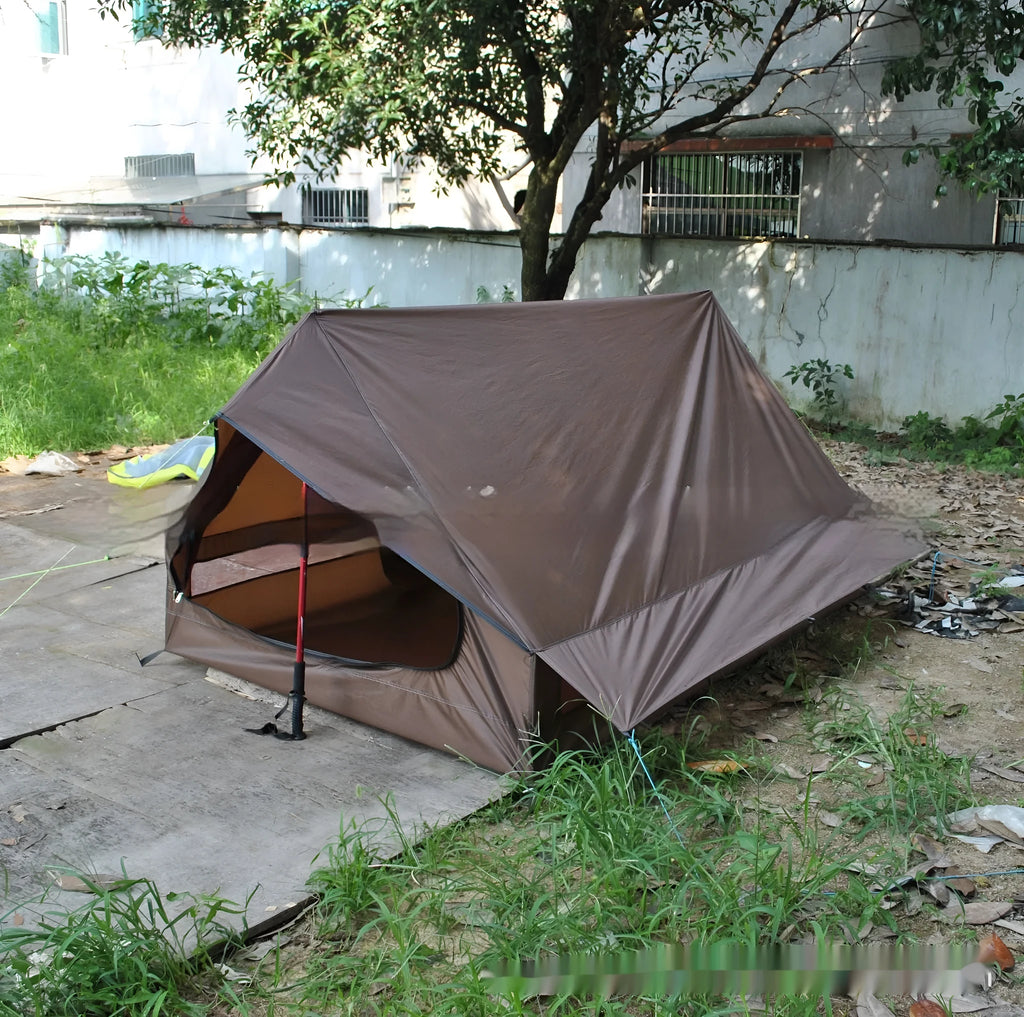 Brown or white A-line pole-free cabin tent for hiking, shown packed and pitched.