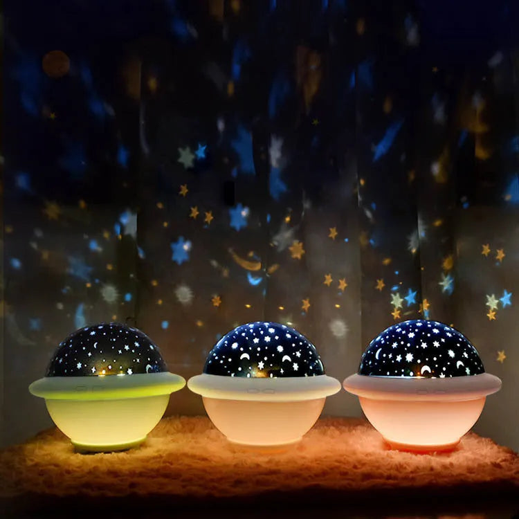 Green UFO shaped LED night light projecting starry sky pattern on ceiling