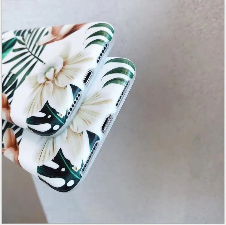 Soft TPU iPhone case with printed floral banana leaf design on the back.
