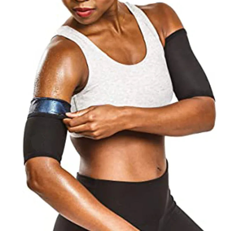 Blue compression arm band with a separate black wrist support strap laid flat.