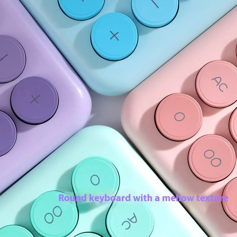 Gradient colour desk calculator showing violet, pink, blue, and green shades on an ABS plastic casing.