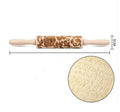 Wooden rolling pin with embossed Christmas pattern, measuring 45cm long.