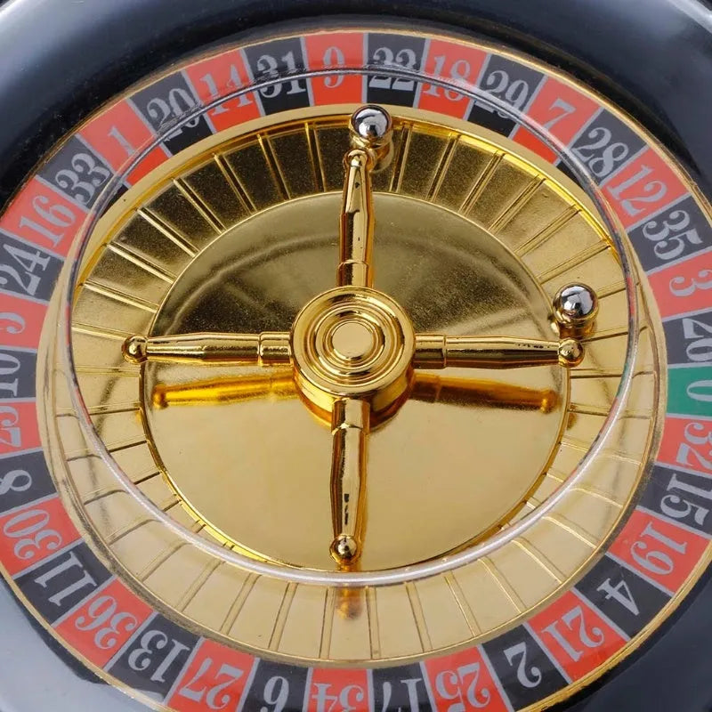 Electric Russian lucky wheel roulette wine set with spinning turntable, six glass shot glasses, and two steel balls on a table