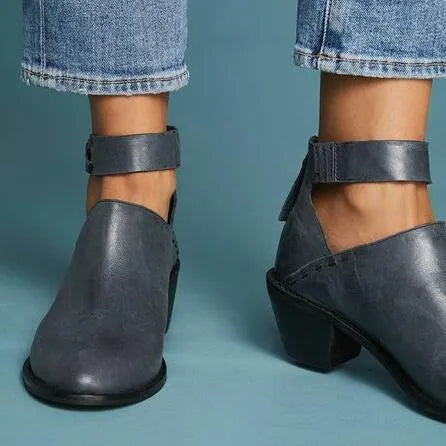 Vintage high heels woman ankle boots with round toe and middle heel in black artificial PU