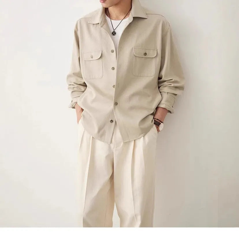 Men's light sand rice coloured long sleeve shirt with a simple lapel and collage stitching.