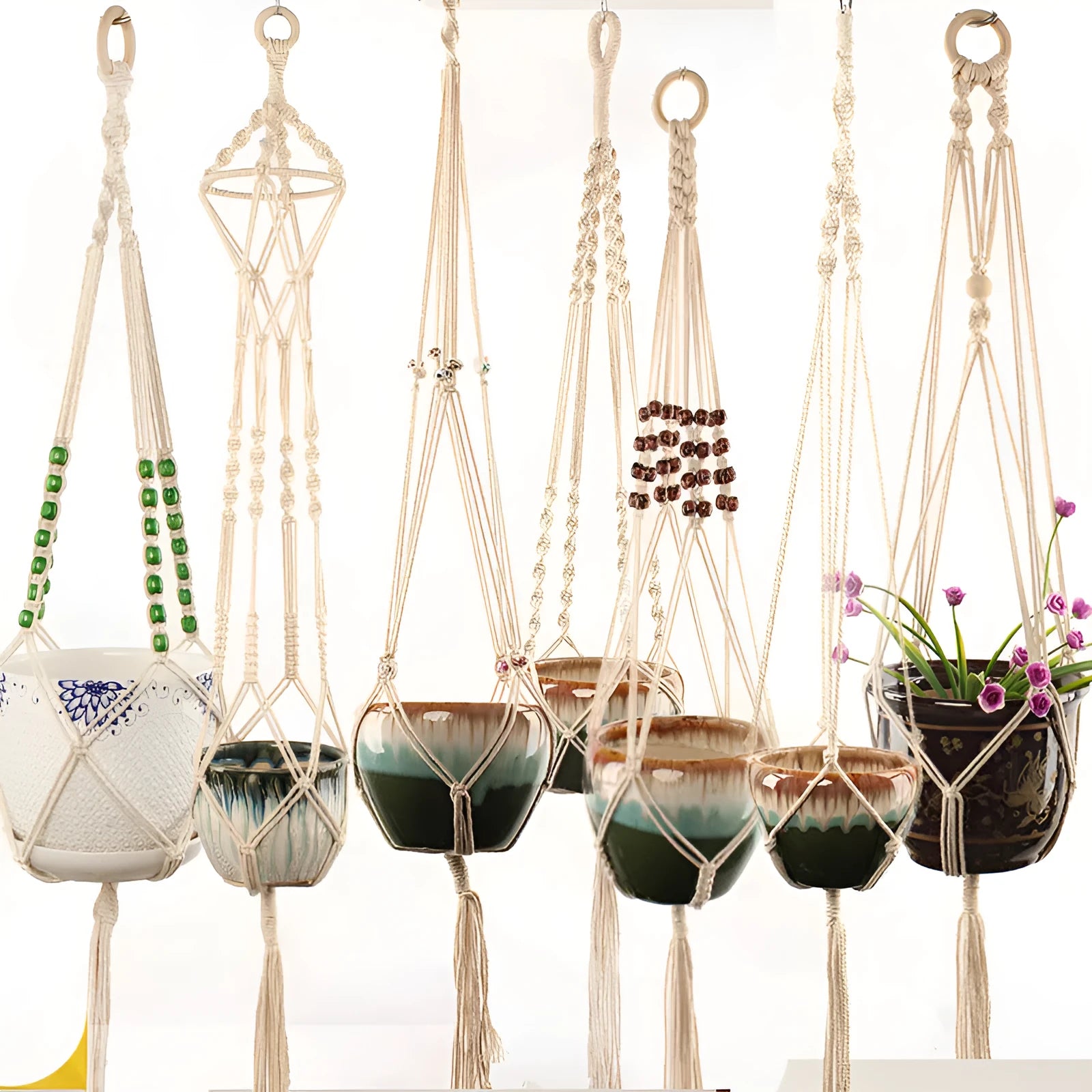 Woven cotton rope plant pot holder for wall mounting or desktop plant display.