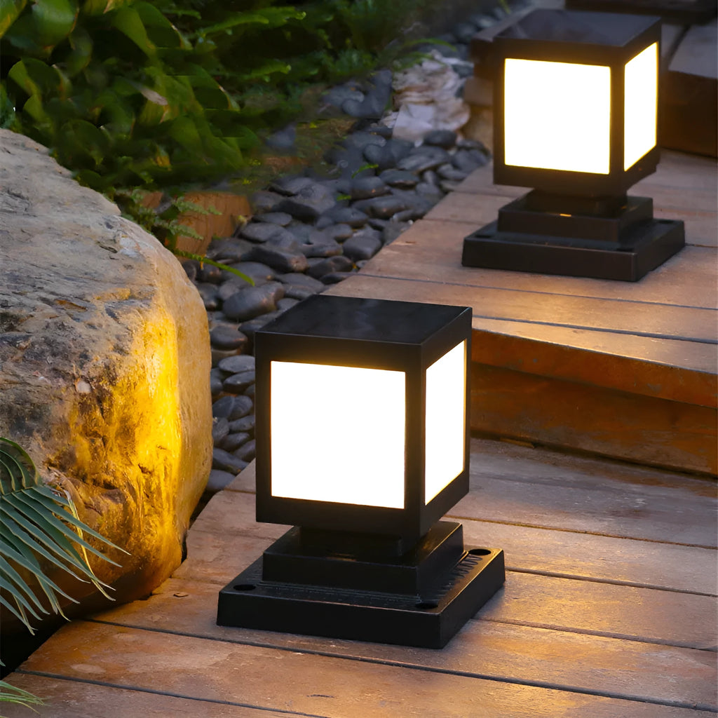 Set of solar-powered waterproof garden lights installed along a lawn edge and on a wall.