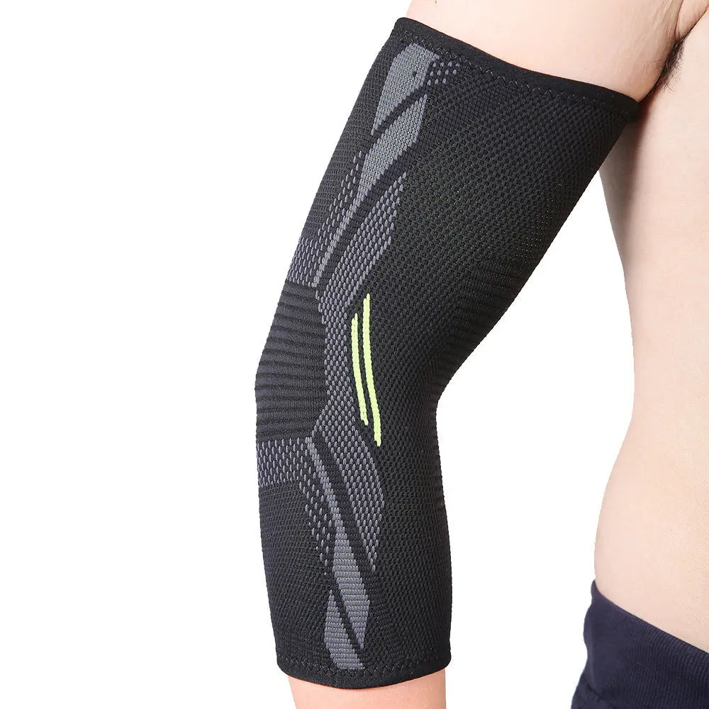Black elbow support compression sleeve with anti-slip knitted design on a person's arm.