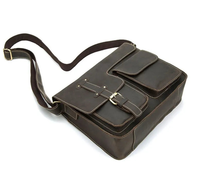 Genuine leather vintage messenger bag with crossbody strap in dark coffee colour showing flap closure