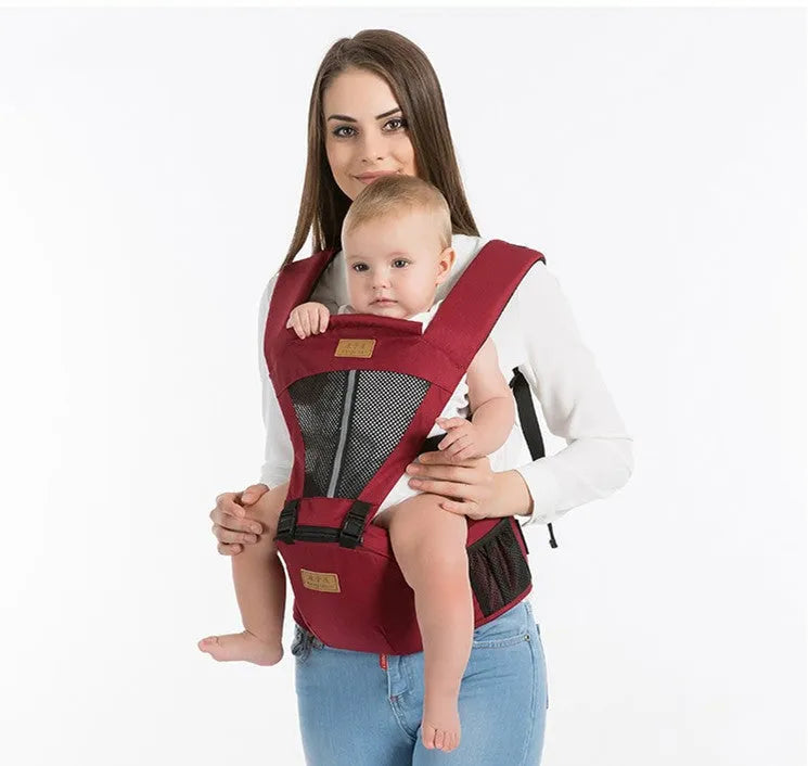 Multifunctional baby carrier in black, 100% cotton, with waist support and three carrying positions for newborn to toddler