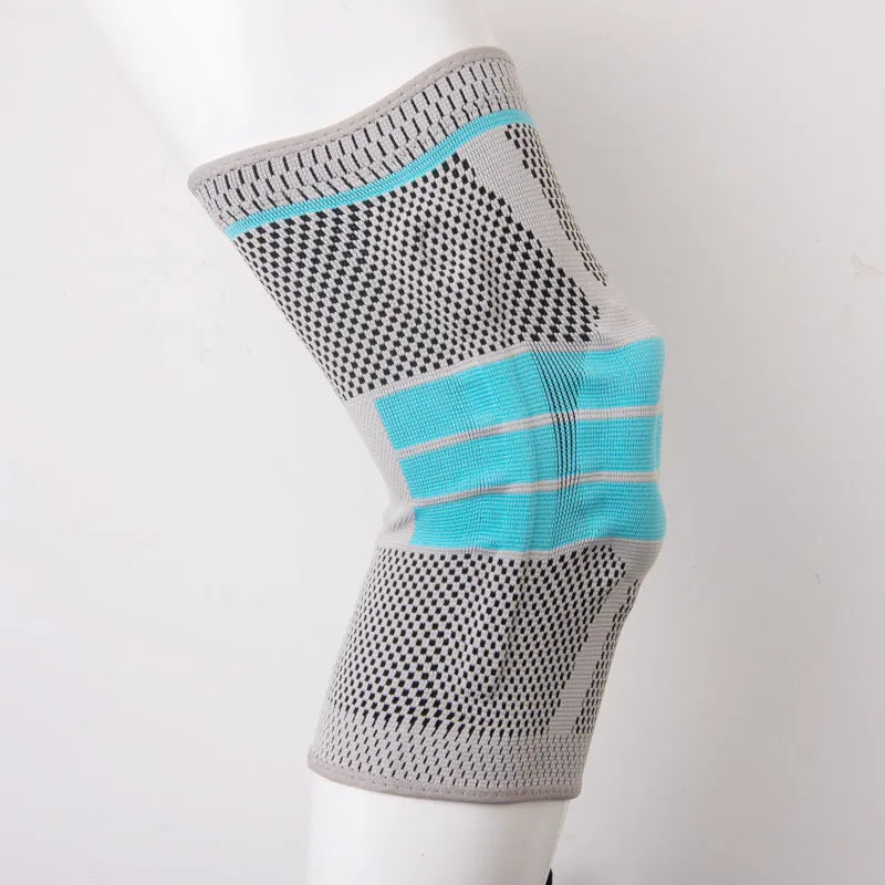 Sky blue elastic knee pads with silicone grip for sports support.