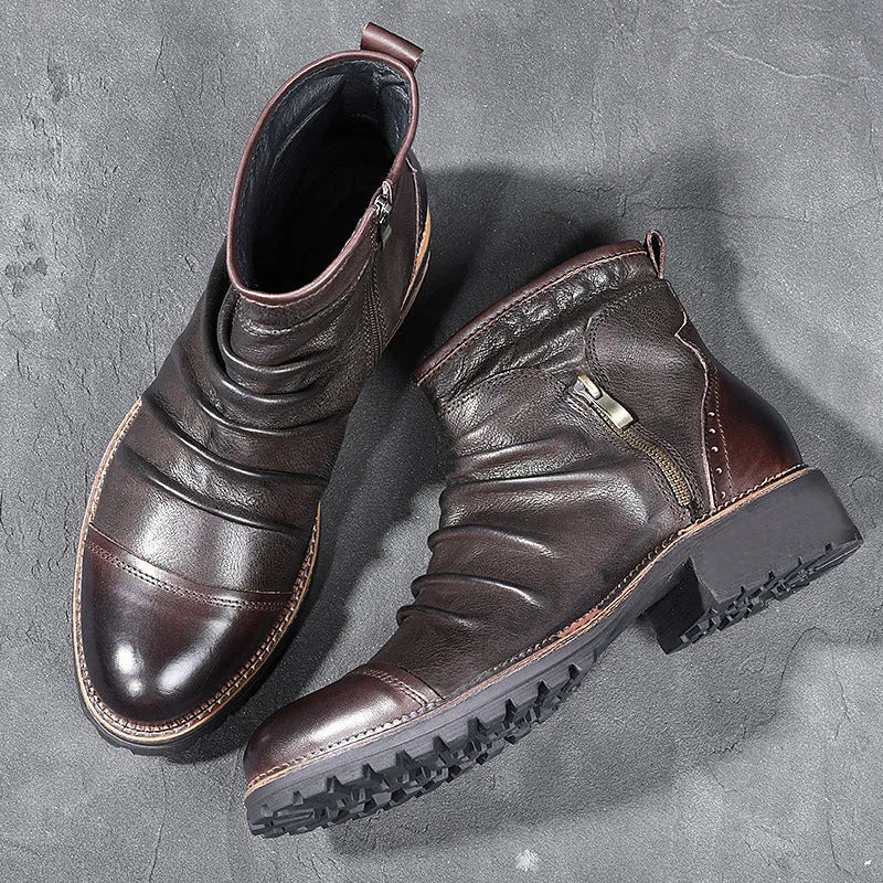 Black cowboy boots with side zip closure, embossed PU uppers, and horseshoe heel on wooden floor