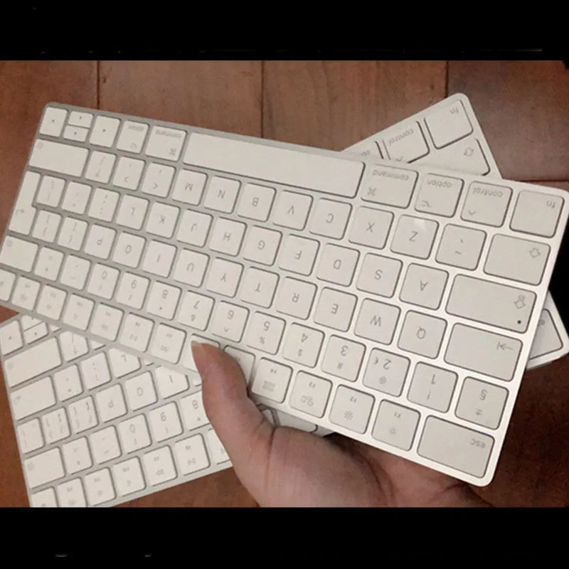 Apple white Bluetooth wireless keyboard with metal construction and multimedia keys