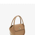 Women's leather wing tote bag with cross-body strap and latch closure in various colour options