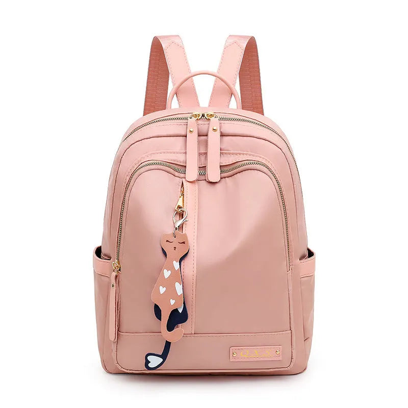 Women's black casual nylon backpack with shoulder straps showing external pockets and organised interior compartments