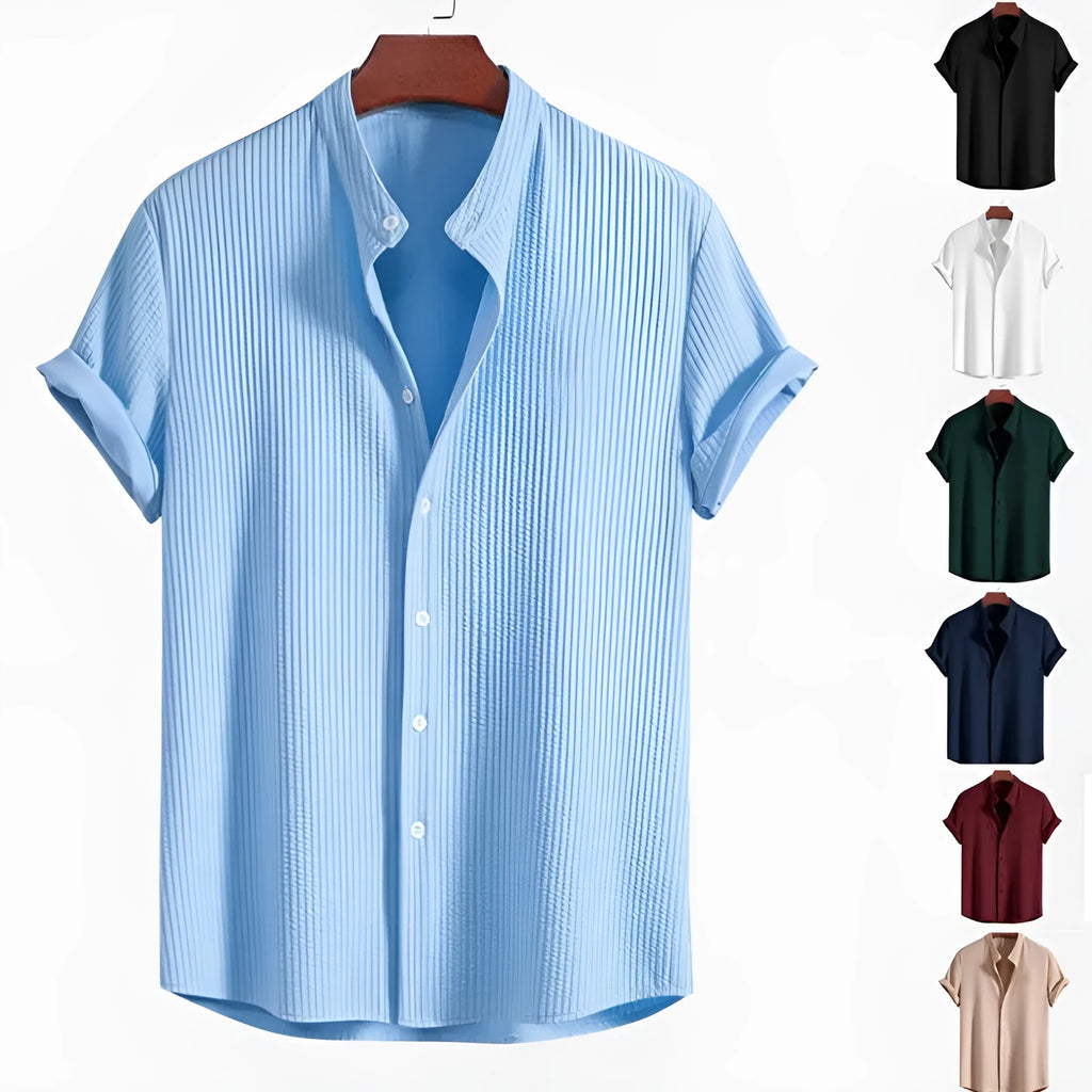 Man wearing a loose-fit short sleeve casual shirt in a solid colour, available in multiple sizes.
