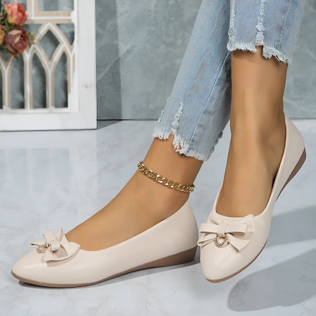 Women's beige casual flat shoes with a bowknot and round toe, showing the shallow mouth design.