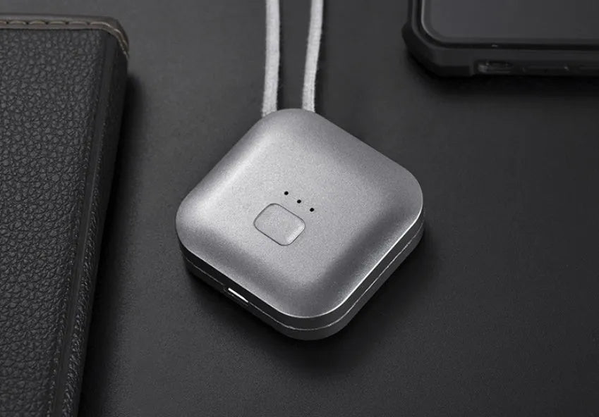 Mini USB portable air purifier necklace worn as a collar, showing pink and blue colour options.