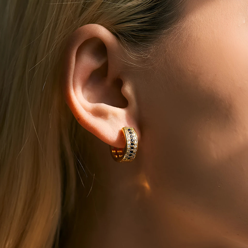 Geometric round women's post earrings with a gold electroplated finish on a copper base.