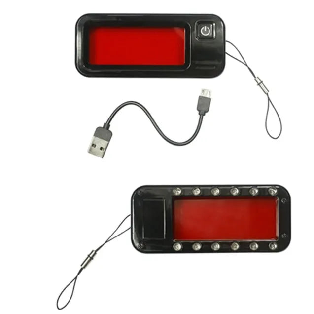 Small red laser reverse camera detector for finding hidden lenses, showing compact dimensions.