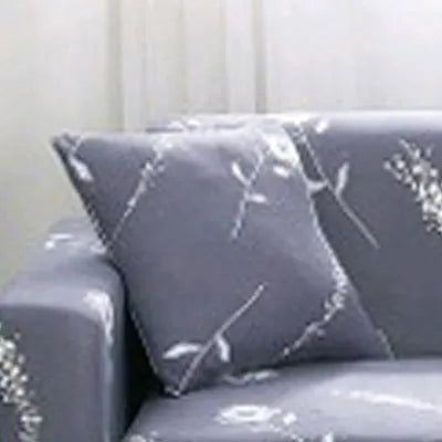 Printed geometric pattern stretch sofa slipcover on three-seater sofa
