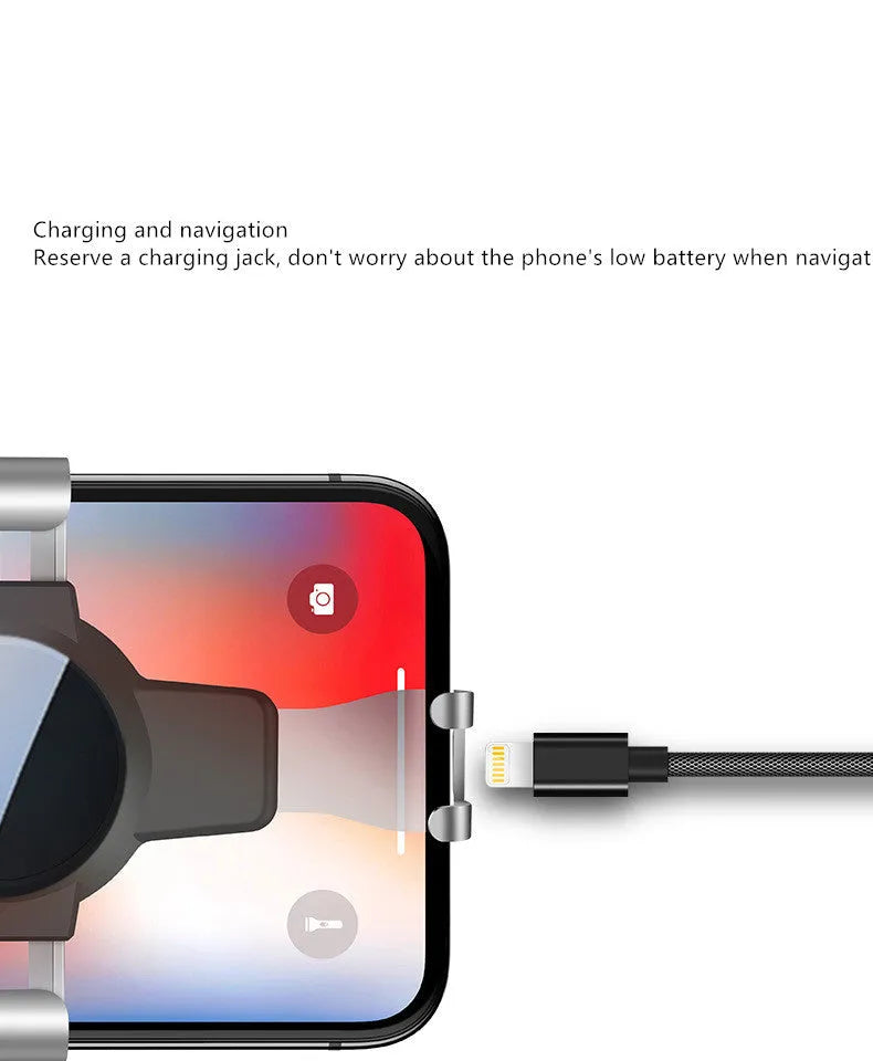 Black S4 gravity mirror ABS car phone holder attached to a vehicle's air conditioning vent.