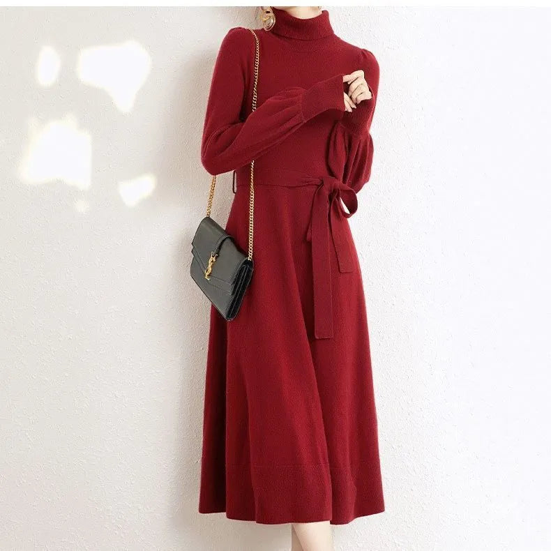 Rose red knit dress with a turtleneck collar, long sleeves, an elastic waist, and a loose big-hemmed midi skirt.