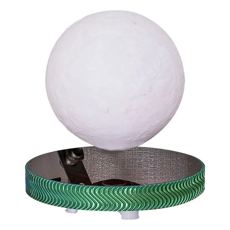 Magnetic suspension moon lamp floating above base with 3D printed celestial design