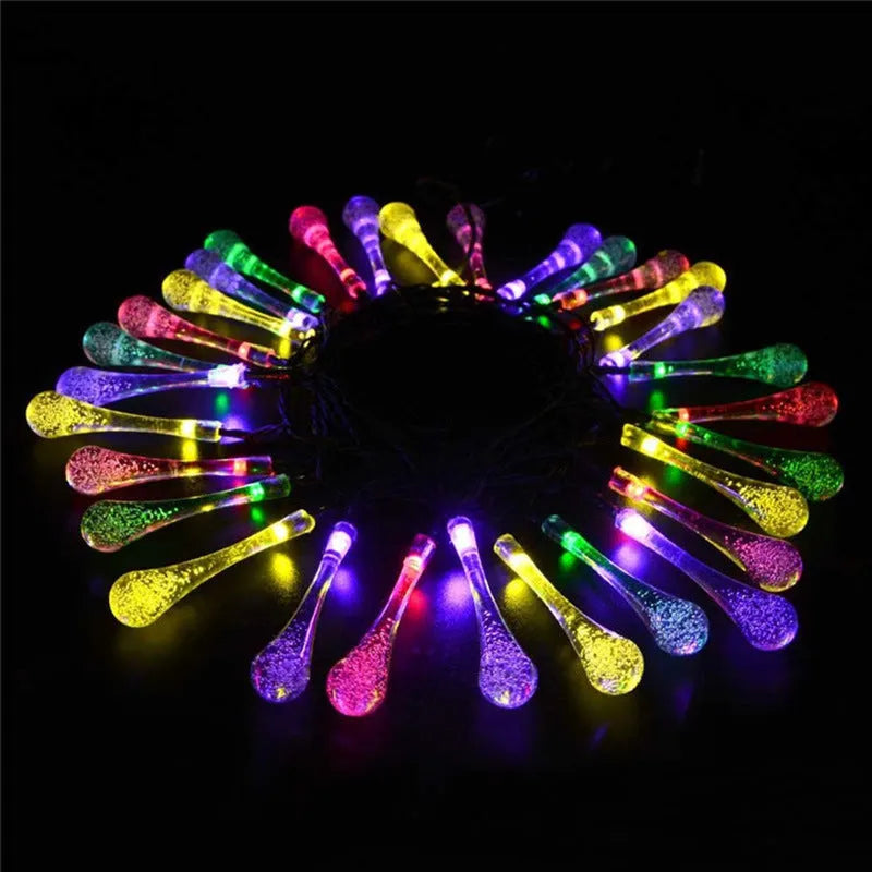 Solar-powered LED string lights with bubble drop pendants on 6.5 metre cable for outdoor garden decoration