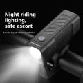 Black USB rechargeable bicycle headlight with quick-release strap mount on handlebars