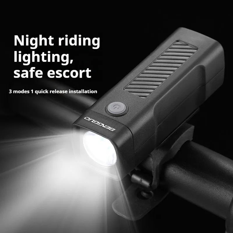 Black USB rechargeable bicycle headlight with quick-release strap mount on handlebars