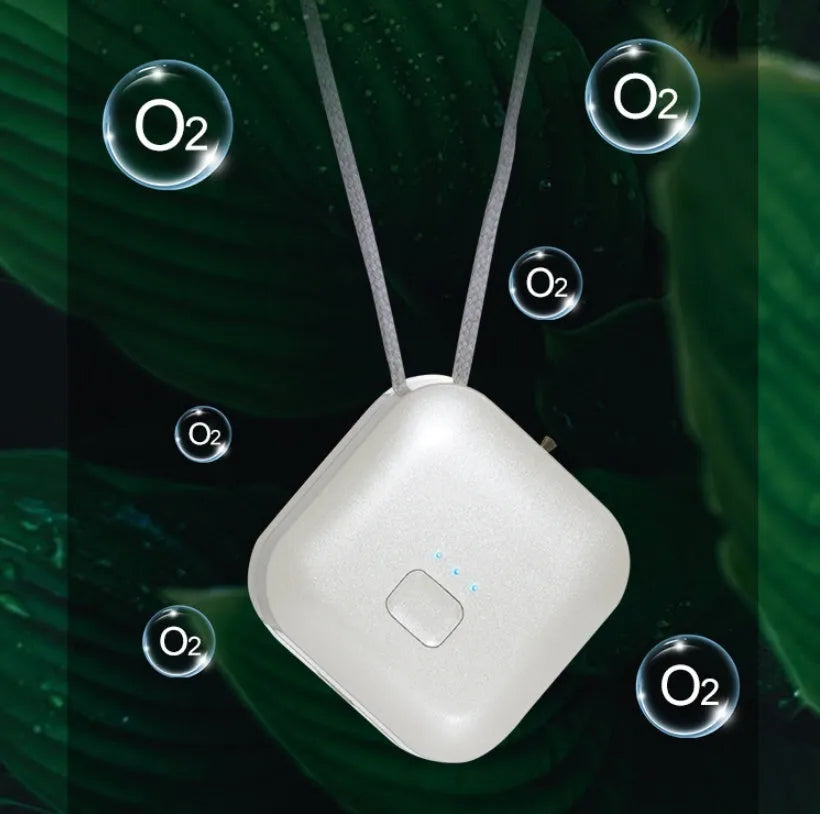 Mini USB portable air purifier necklace worn as a collar, showing pink and blue colour options.
